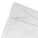 Dettaglio decorazione asciugamani bianchi per hotel Oslo