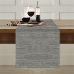 Runner antimacchia Flammè cenere steso sul tavolo