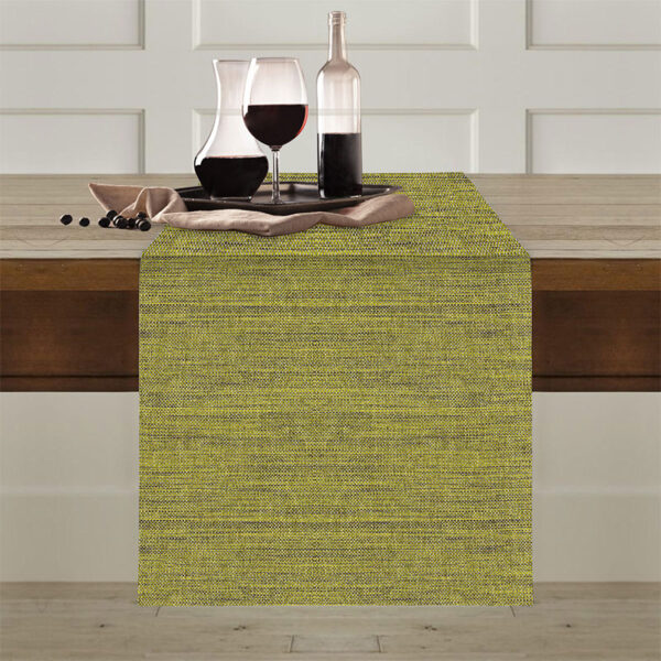 Runner antimacchia Flammè pistacchio steso sul tavolo